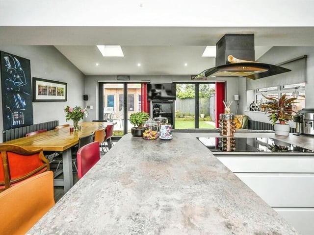 There is space within the kitchen for a lengthy dining table, while bi-folding doors lead to the back garden. A window to the side adds further brightness, while a vinyl laminate floor adds further style.