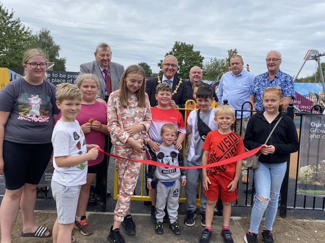 Children cut the ribbon to open the new play area on the Bellamy estate in Mansfield