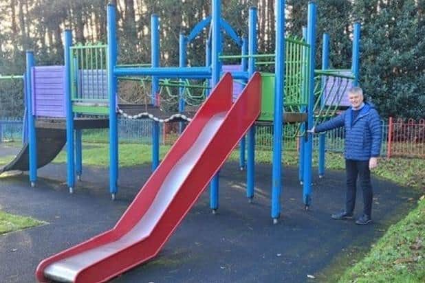 Coun Martin Smith, parish council leader, by the old play equipment that will soon be replaced