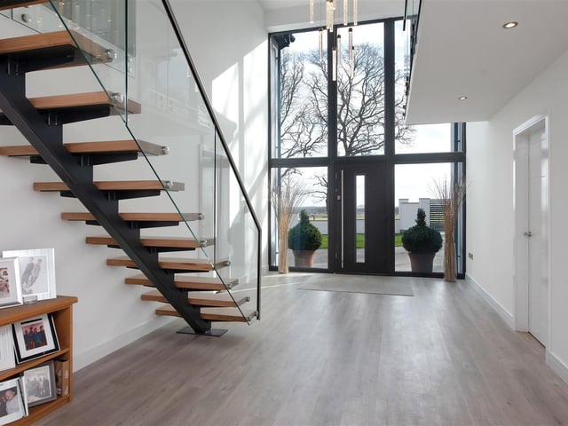 The ground floor includes a magnificent atrium reception hall.