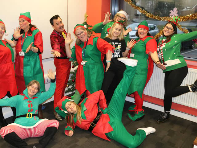 Staff at West Nottinghamshire College in Mansfield dress up as elves as part of a fun Christmas campaign by students to raise money for the Alzheimer's Society.