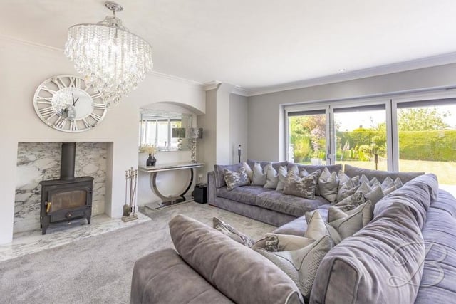 An attractive feature of the living space is this log-burner with marble hearth.