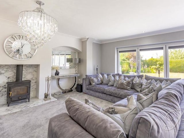 An attractive feature of the living space is this log-burner with marble hearth.