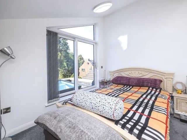 A second shot of the master bedroom at the £300,000 property and its access to a luxurious rooftop balcony.