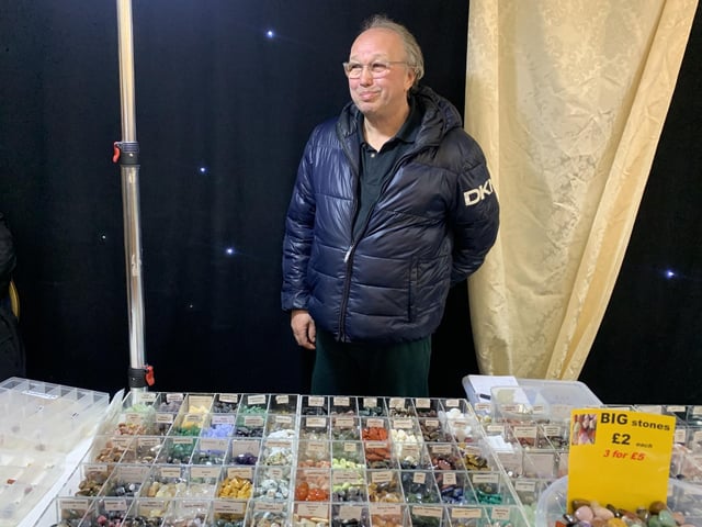 Show organiser Erick Henderson behind his ever-popular crystal stall.