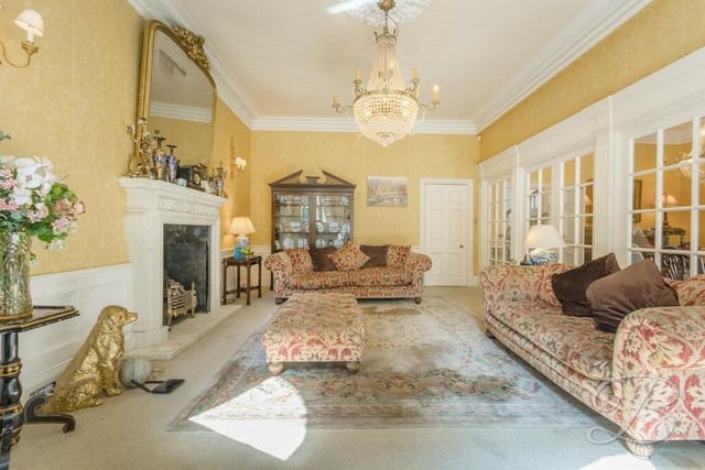 A second shot of the ornate living room, which benefits from fitted carpets. The double doors to the right lead to the dining room.