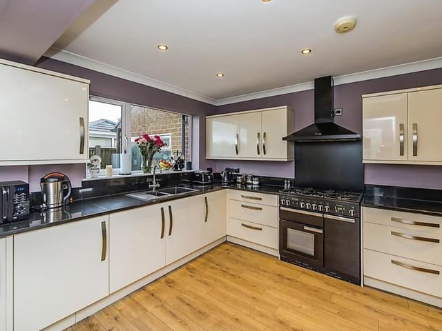 Next stop is the modern kitchen, which is described by estate agents William H.Brown as "extremely spacious". Sleek units blend with contemporary appliances.