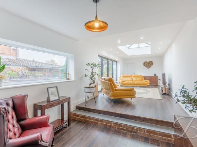The sitting room is a natural extension of the dining room and offers similar luxury, such as oak flooring and underfloor heating
