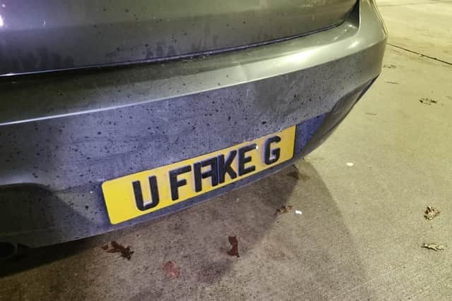 Close up of the "U Fake G" number plate