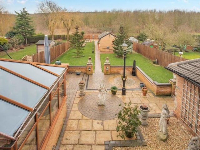 Here is the glorious view from one of the rear windows on the first floor of the property, overlooking the landscaped garden, with the conservatory to the left, and also open countryside.