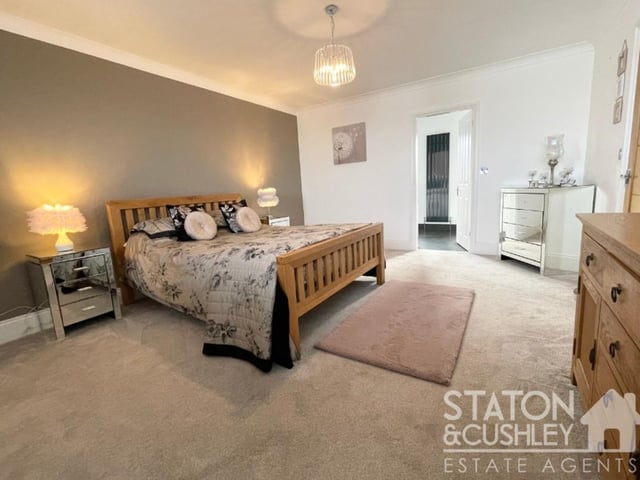 Another first-floor bedroom boasting style and space. Plenty of room for storage and furniture.