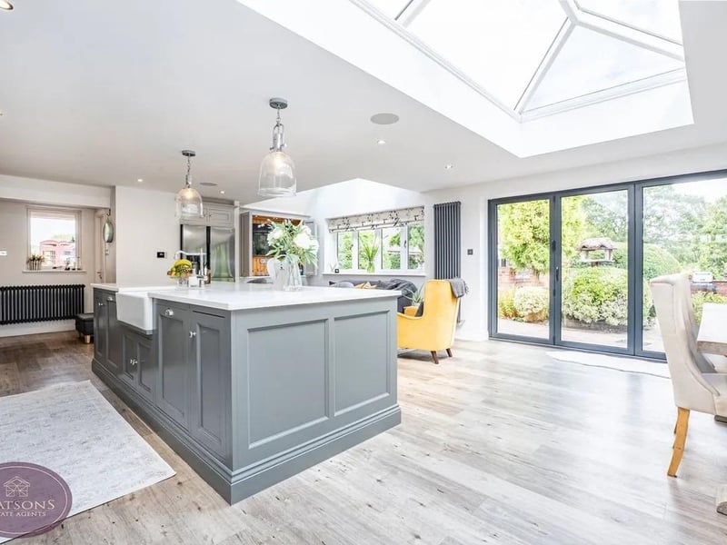 The kitchen/diner features an impressive roof lantern and bi-folding doors opening directly onto the garden, allowing the interior and exterior spaces to flow effortlessly together.