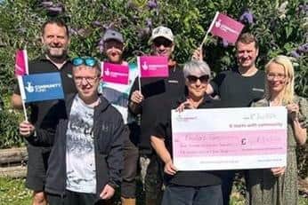 Staff and volunteers at Rhubarb Farm celebrating the funding news.