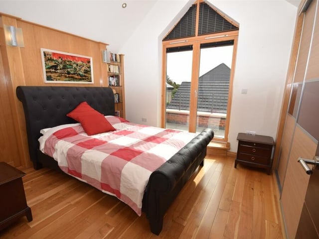 Another showstopping balcony is the main feature of bedroom number three. Its style is further enhanced by built-in wardrobes and a solid oak wood floor.