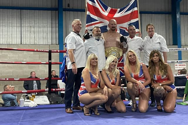 Steve Ward is pictured with his wife, daughters and coaches after his world title win.