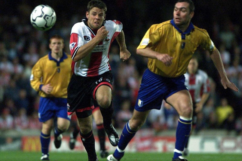 Stuart Hicks tangles with James Beattie of Southampton in the second round, first leg, of The Worthington Cup played at The Dell in Southampton.