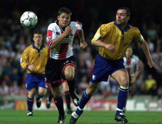 Stuart Hicks tangles with James Beattie of Southampton in the second round, first leg, of The Worthington Cup played at The Dell in Southampton.