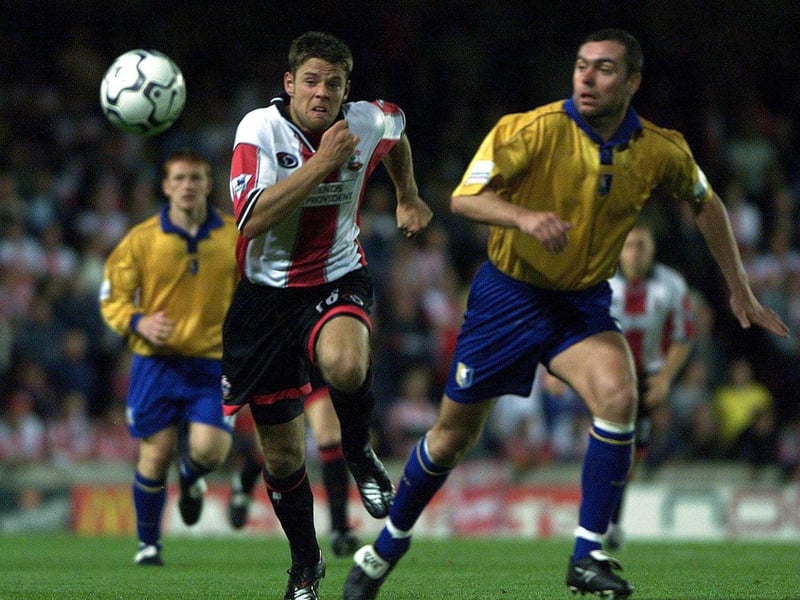 Stuart Hicks tangles with James Beattie of Southampton in the second round, first leg, of The Worthington Cup played at The Dell in Southampton.