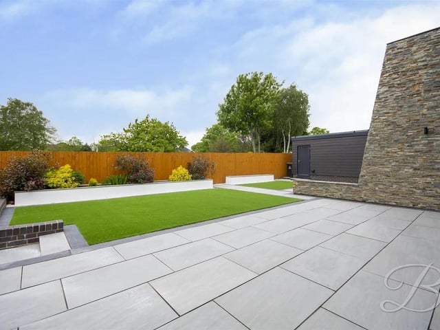 The enclosed garden has been designed with ease of maintenance in mind, featuring an artificial lawn and a well-positioned patio seating area, the perfect tranquil oasis