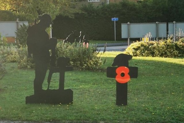 A soldier pays his respects to the fallen.