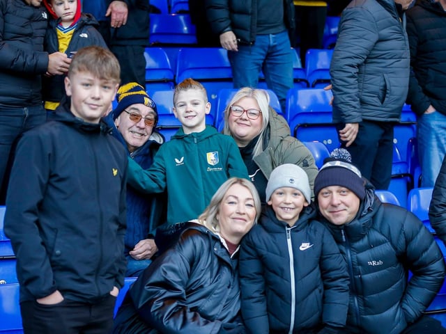 Mansfield Town fans enjoy the win at Stockport County
