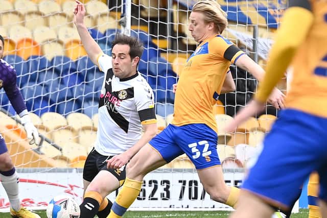 Mansfield's George Lapslie battles with Newport's Matthew Dolan