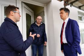 Ed Miliband MP and Mayor Andy Abrahams talking to homeowner, John Greatorex, in Mansfield about work he has had done to help cut down his energy bills