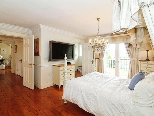 The main bedroom is the largest of the five. Amazingly presented, it has access to two en suites and also a balcony overlooking the back of the property.