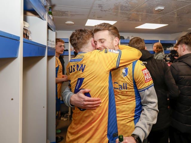 Mansfield Town's fans and players celebrated promotion to League One long into the night.