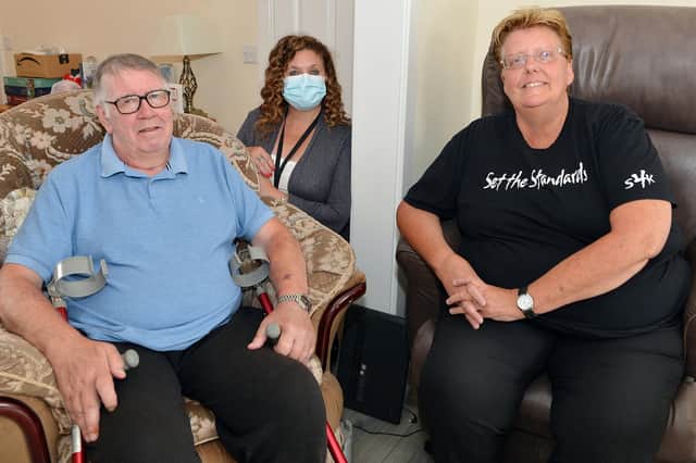 Kirkby grandad Kev Evans with wife Sue and Age UK connect support worker, Deborah Hughes.