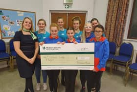 1st Hasland Guides receiving their donation from the Persimmon Homes Community Champions scheme.