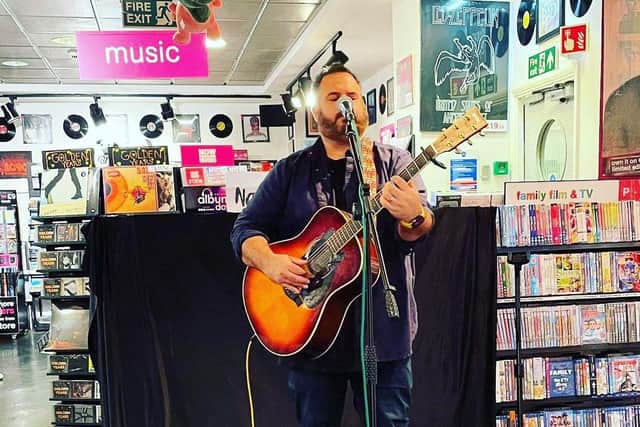 Nanuk, performing his new single 'Butterfly', for crowds at the Mansfield HMV store.