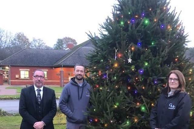 Manager Andrew Smith and two members of his team at Sherwood Forest Crematorium by the memorial Christmas tree.