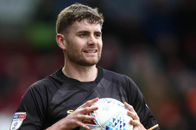 Joe Riley has extended his Mansfield Town contract to June 2021.