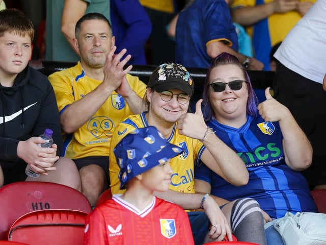 Mansfield Town fans watch the 1-1 draw at Grimsby in League Two.
