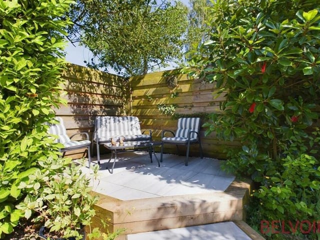 Nestled neatly in a quiet corner of the rear garden is this lovely, secluded and raised seating area.