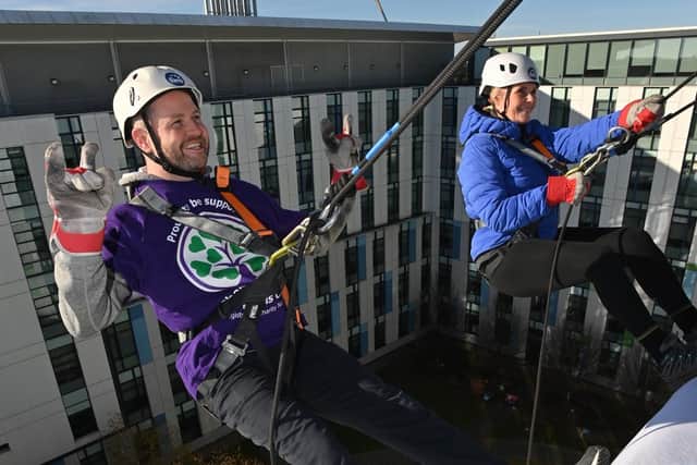Richard Mills and Sarah Godber abseil from the roof of King's Mill Hospital