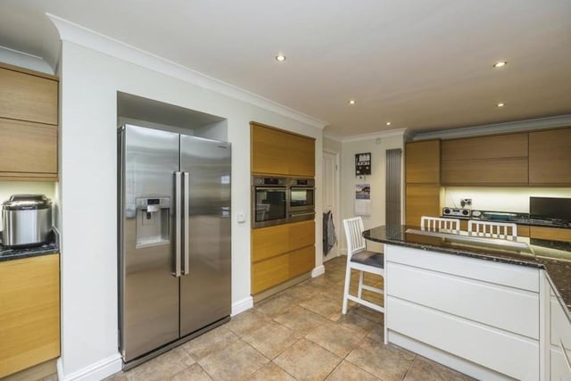 The breakfast kitchen at the £475,000 bungalow is a stunner, with its breakfast bar, tiled flooring and space for an American-style fridge/freezer. Integrated appliances include a single electric combi oven/microwave, warming drawer, induction hob with discreet extractor fan, washing machine and dishwasher.