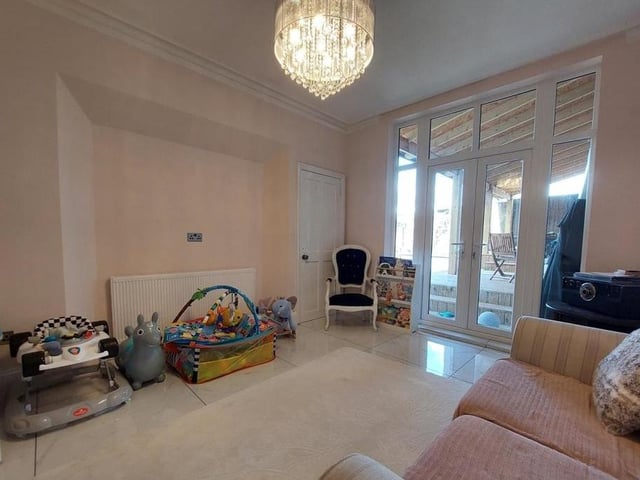 The second lounge is as comfortable as the first. It gives access to a seating area in the back garden.