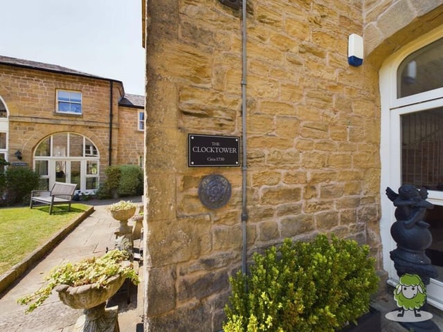 The plaque that reveals how The Clock Tower building dates back to 1730 when it was the country house residence of a well-known local employer.