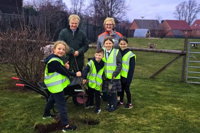 Councillor Neil Clarke and Julie Adams (Veolia) with pupils from Sparken Hill Academy