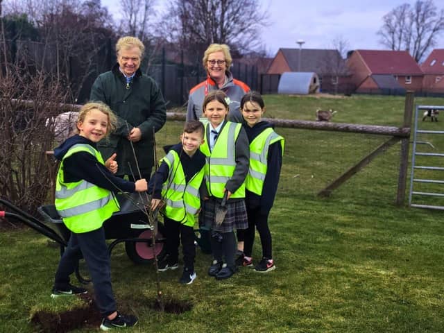 Councillor Neil Clarke and Julie Adams (Veolia) with pupils from Sparken Hill Academy