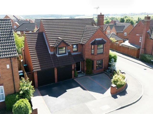 Let's return to the front of the house, where there is plenty of off-street parking space, as well as an integral double garage that has been partially converted into a utility room but also retains storage space.