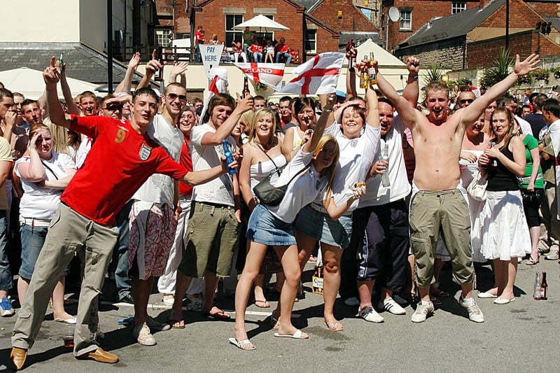 England fans celebrate in the sun as they watch England's opening game of the 2006 World Cup at The Swan.