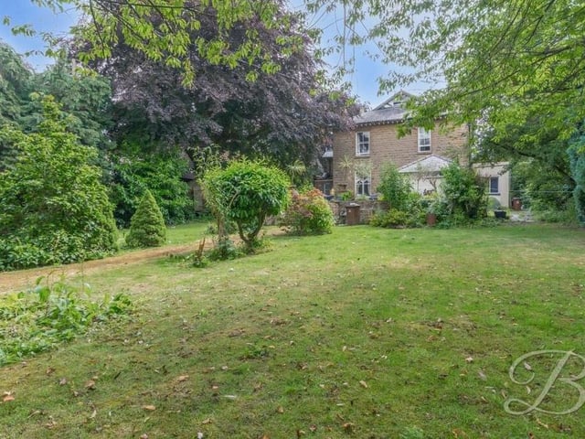 The rear garden is a wonderful size and distinguished by extensive, well-maintained lawns.