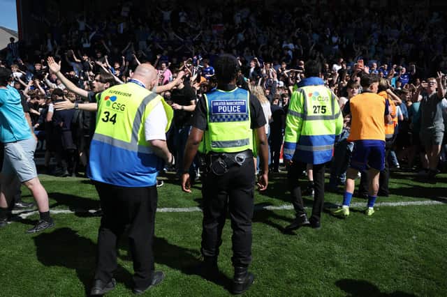 Police and stewards attempt to control the Rochdale fans during the Enterprise National League match between Rochdale and York City at Crown Oil Arena on April 25, 2026 in Rochdale, England. (Photo by Carl Recine/Getty Images)
