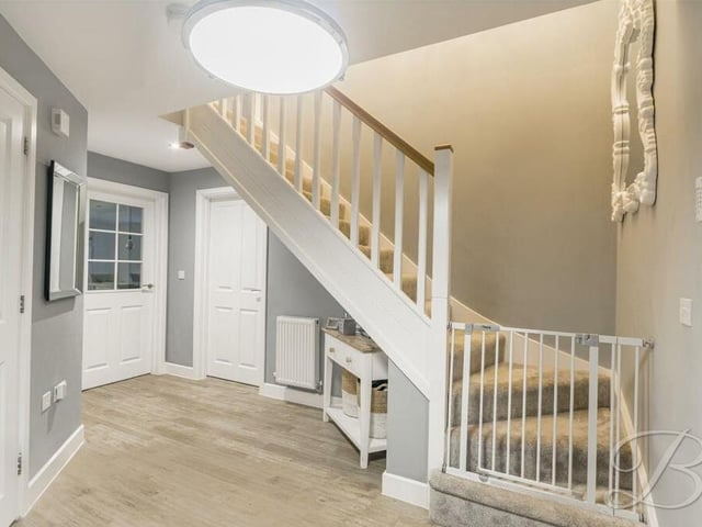 Time to pop up to the first floor now, so let's make our way through the bright and airy entrance hall to climb the staircase.