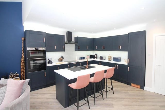 The kitchen oozes class and style. Integrated appliances include a waist-height electric oven, an electric hob with extractor over, a fridge/freezer and dishwasher.
