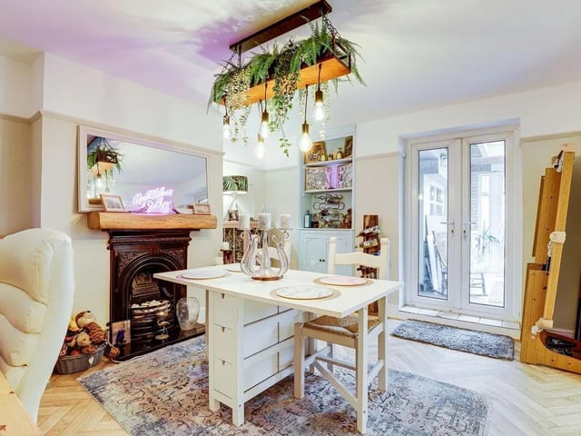 One of two reception rooms, featuring charming cast iron fireplaces.