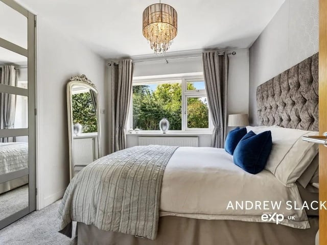 One of four spacious bedrooms.